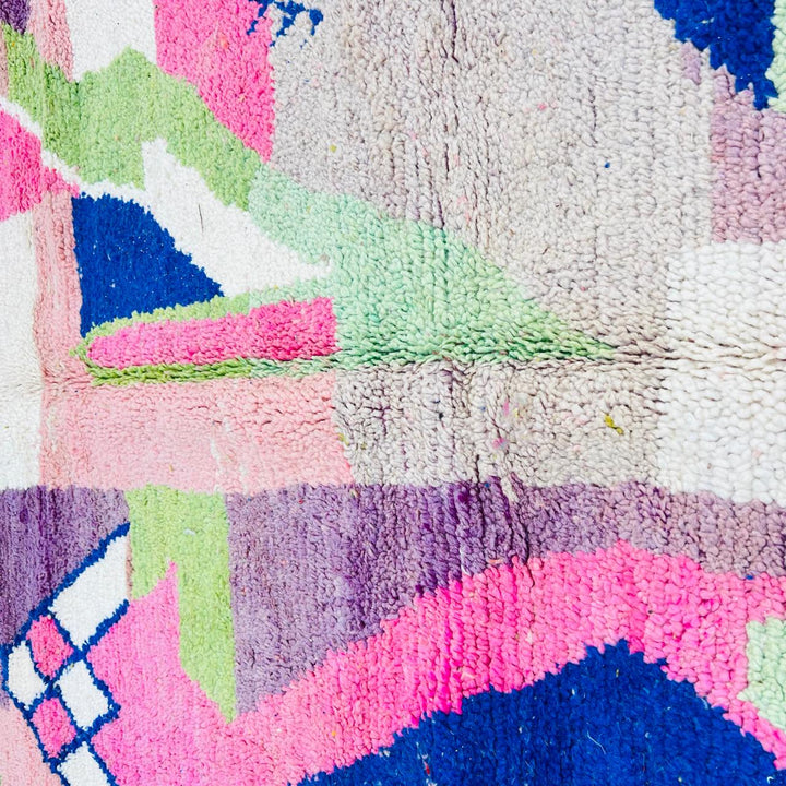 Vintage Moroccan wool rug 518 with pink base and colorful Berber geometric symbols, handmade in Morocco