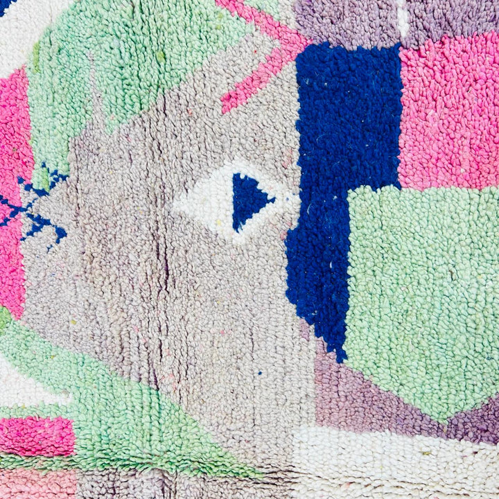 Vintage Moroccan wool rug 518 with pink base and colorful Berber geometric symbols, handmade in Morocco