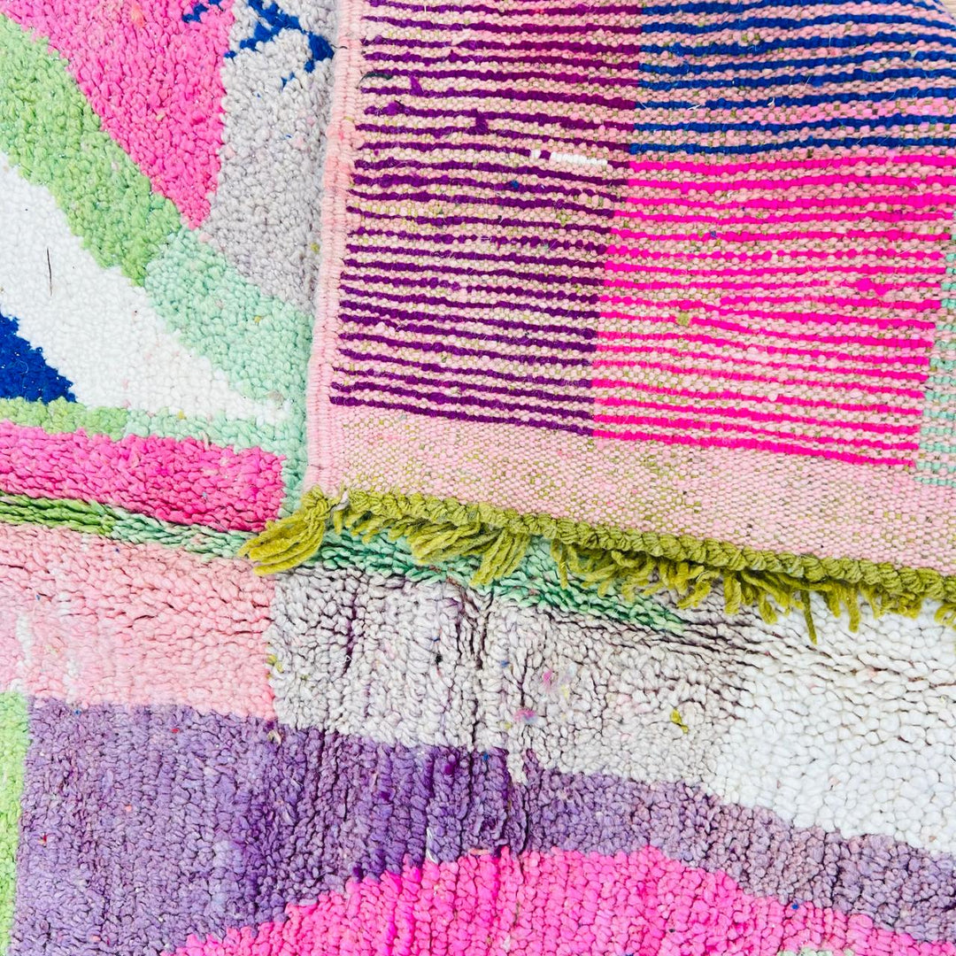Vintage Moroccan wool rug 518 with pink base and colorful Berber geometric symbols, handmade in Morocco