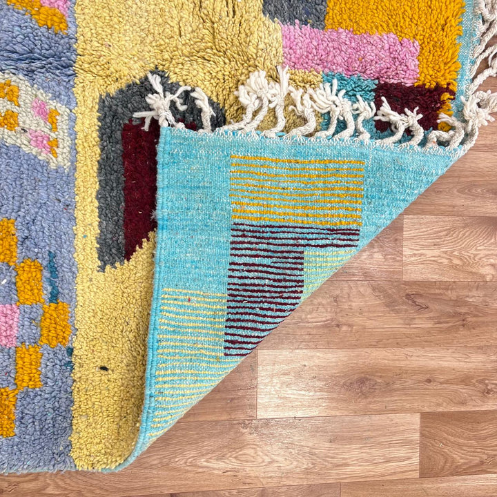 Vintage Moroccan wool rug with colorful vertical stripes and geometric Berber pattern, handmade in Morocco, size 253 x 155 cm.
