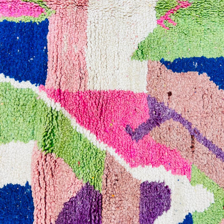 Vintage Moroccan wool rug 518 with pink base and colorful Berber geometric symbols, handmade in Morocco