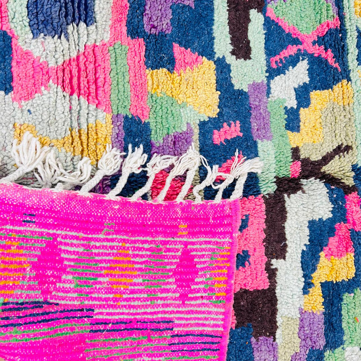Vintage Moroccan wool rug with colorful geometric Berber pattern, pink blue cream yellow, 235x158 cm handmade in Morocco