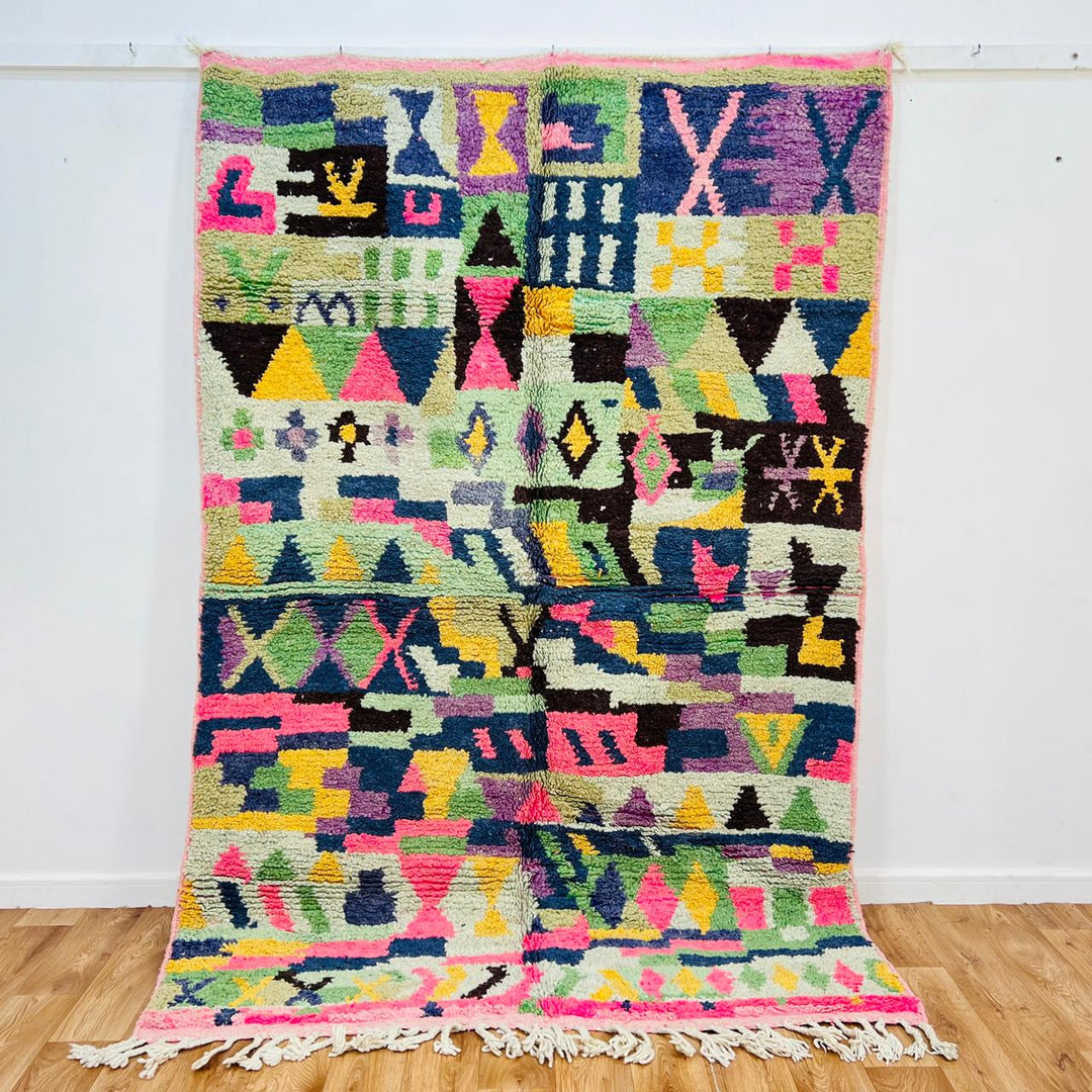 Vintage Moroccan wool rug with colorful geometric Berber pattern, pink blue cream yellow, 235x158 cm handmade in Morocco