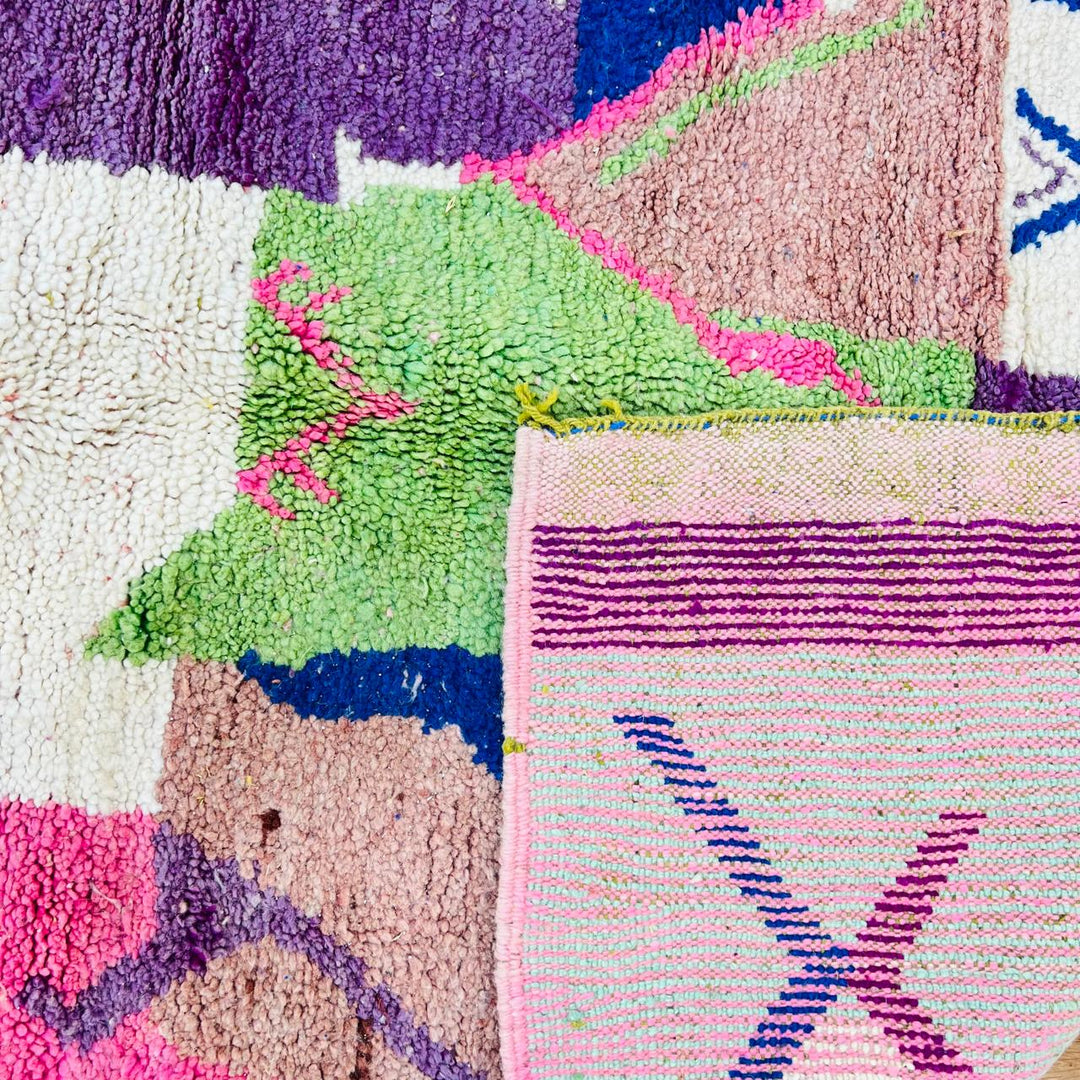 Vintage Moroccan wool rug 518 with pink base and colorful Berber geometric symbols, handmade in Morocco