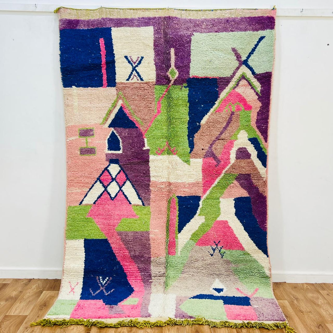 Vintage Moroccan wool rug 518 with pink base and colorful Berber geometric symbols, handmade in Morocco