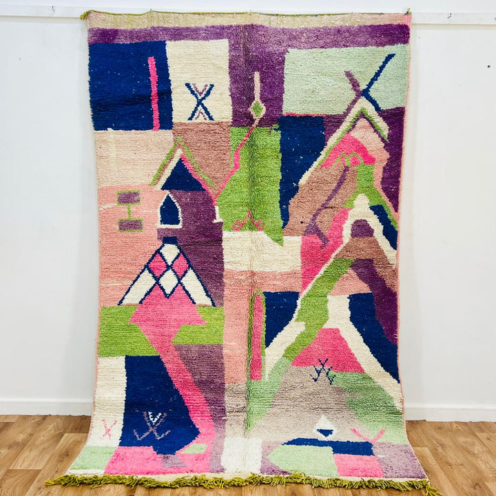 Vintage Moroccan wool rug 518 with pink base and colorful Berber geometric symbols, handmade in Morocco