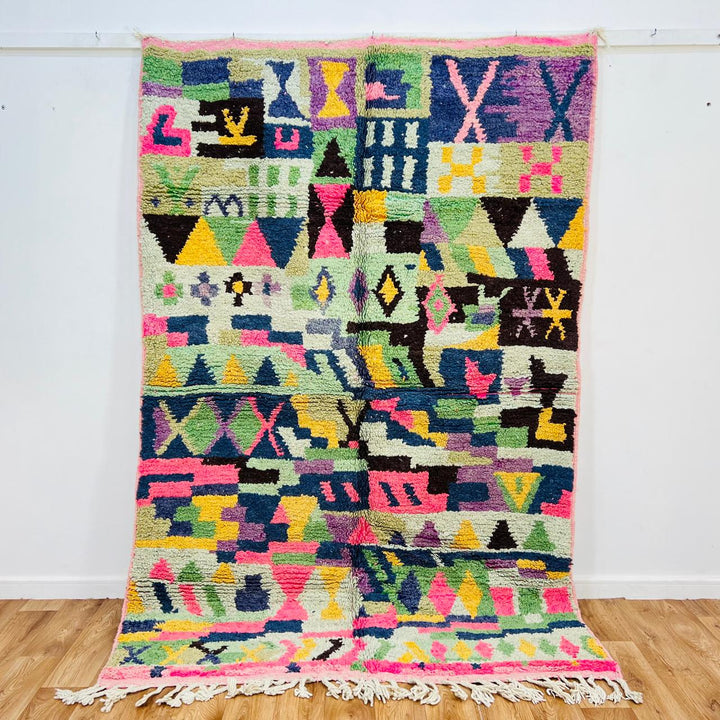 Vintage Moroccan wool rug with colorful geometric Berber pattern, pink blue cream yellow, 235x158 cm handmade in Morocco
