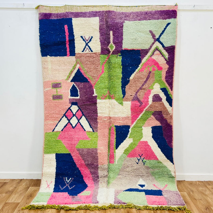 Vintage Moroccan wool rug 518 with pink base and colorful Berber geometric symbols, handmade in Morocco