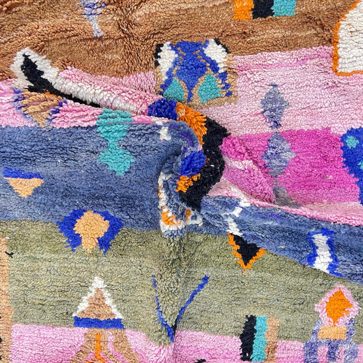 Vintage Moroccan Berber rug with abstract tribal design on pink wool, handmade in Morocco