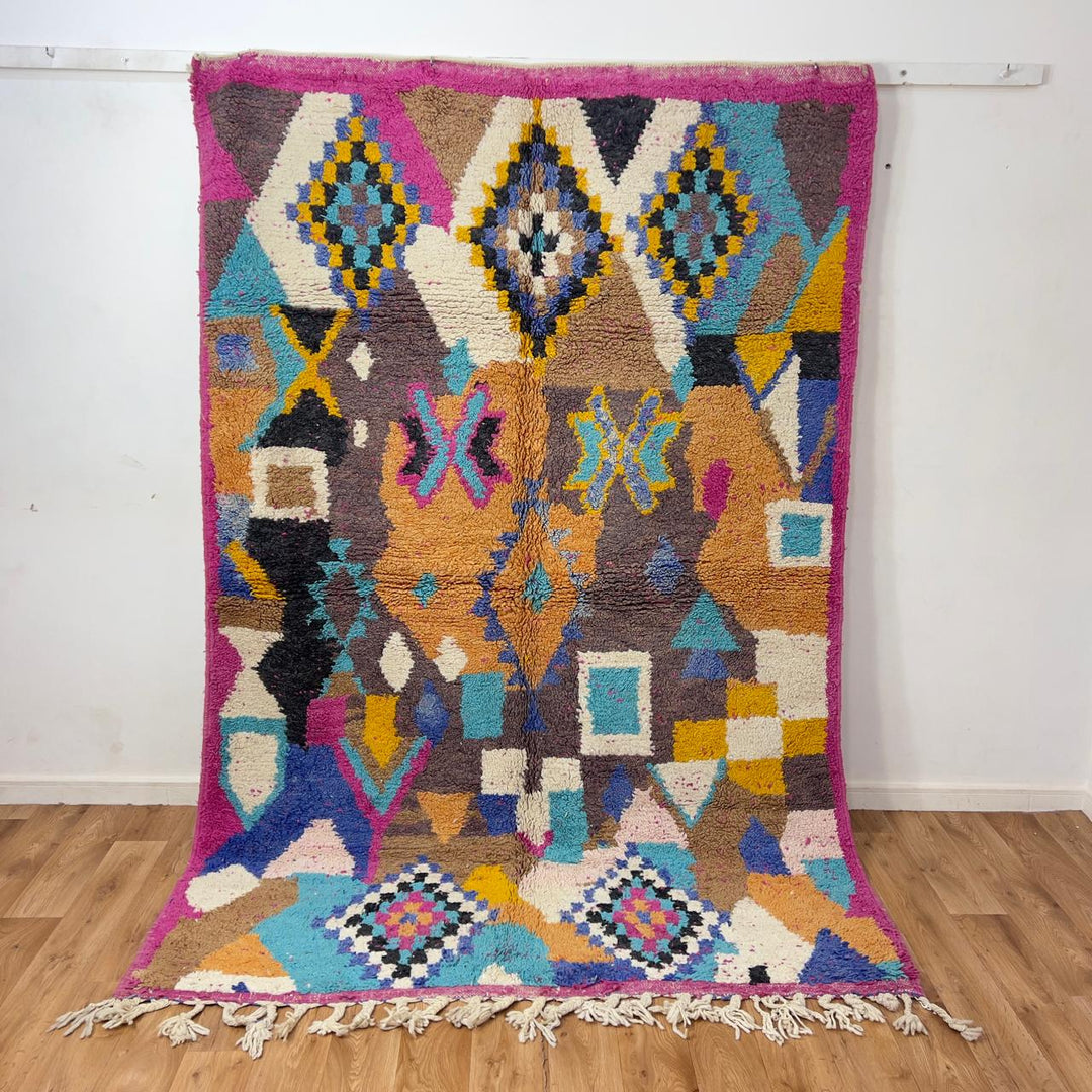 Vintage Moroccan wool rug 8.53x5.68 ft, handmade Berber shag carpet with colorful geometric tribal patterns in brown, pink, blue and mustard tones