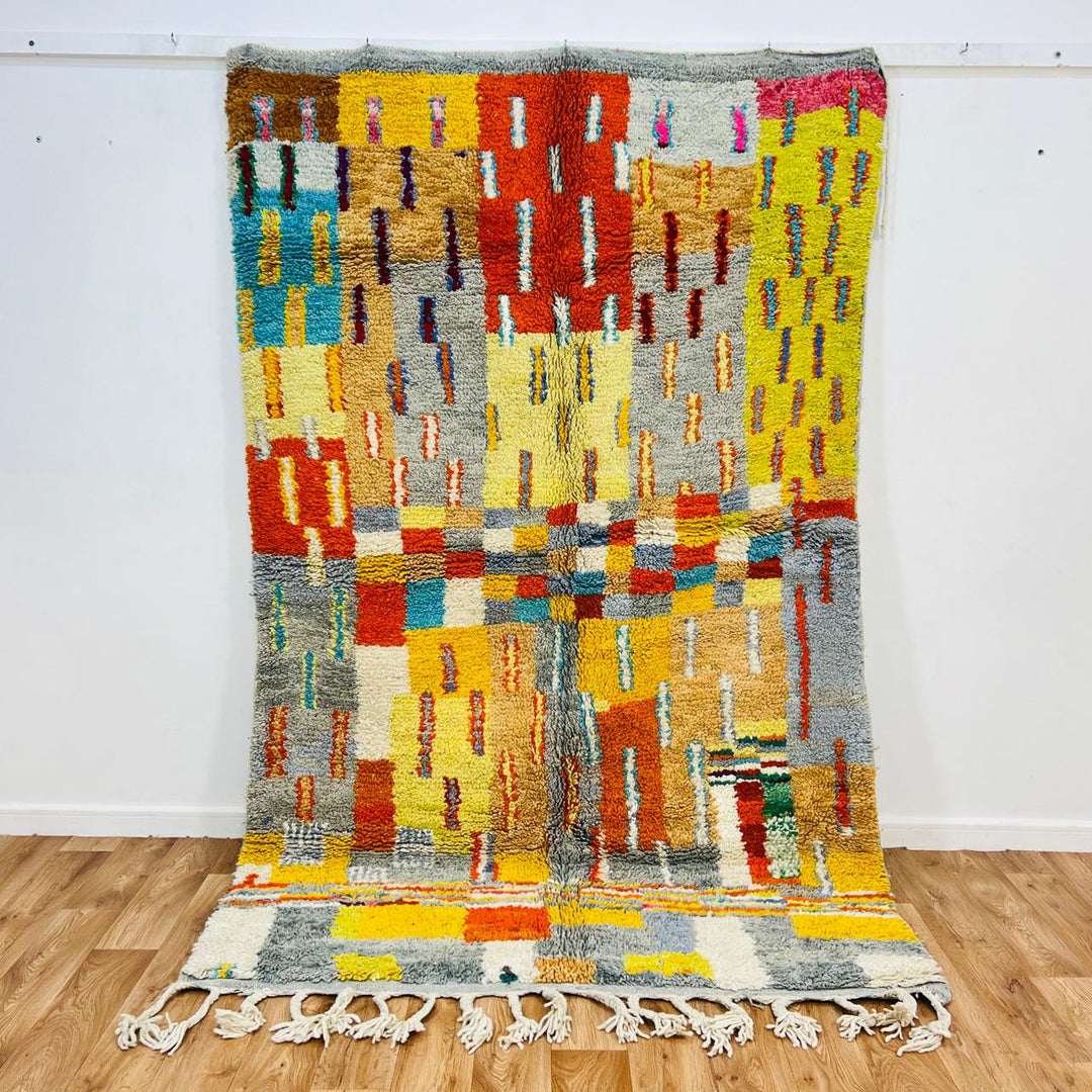 Vintage Moroccan wool rug with geometric patterns in yellow, grey, teal and orange – handmade Berber rug from Morocco