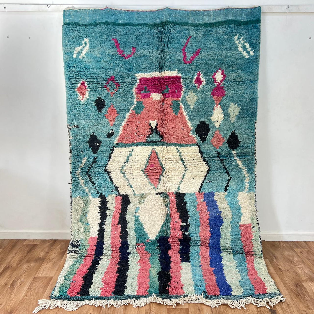 Vintage Moroccan wool rug in turquoise and pink tones with tribal Berber patterns, handmade in Morocco