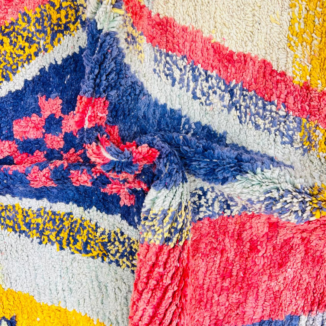 Vintage Moroccan wool rug with abstract Berber geometric design in coral pink, mustard yellow, navy and cream, handmade in Morocco