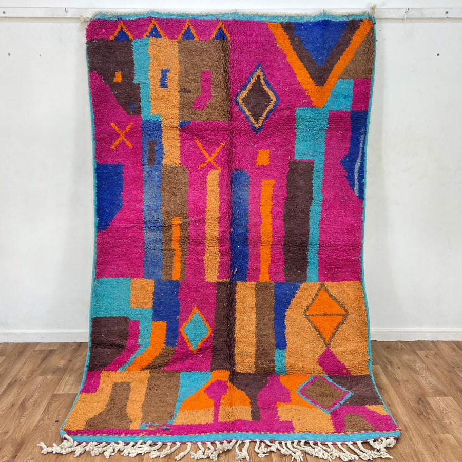Vintage Moroccan wool rug with colorful Berber geometric patterns in pink, blue, and orange