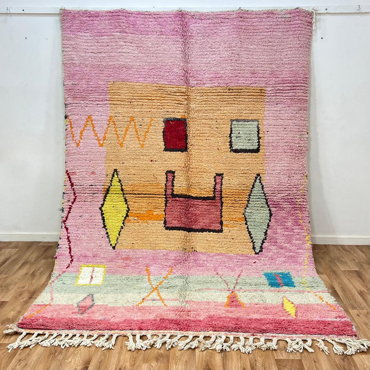 Vintage Moroccan wool rug with pink tones and abstract Berber symbols, handmade in Morocco