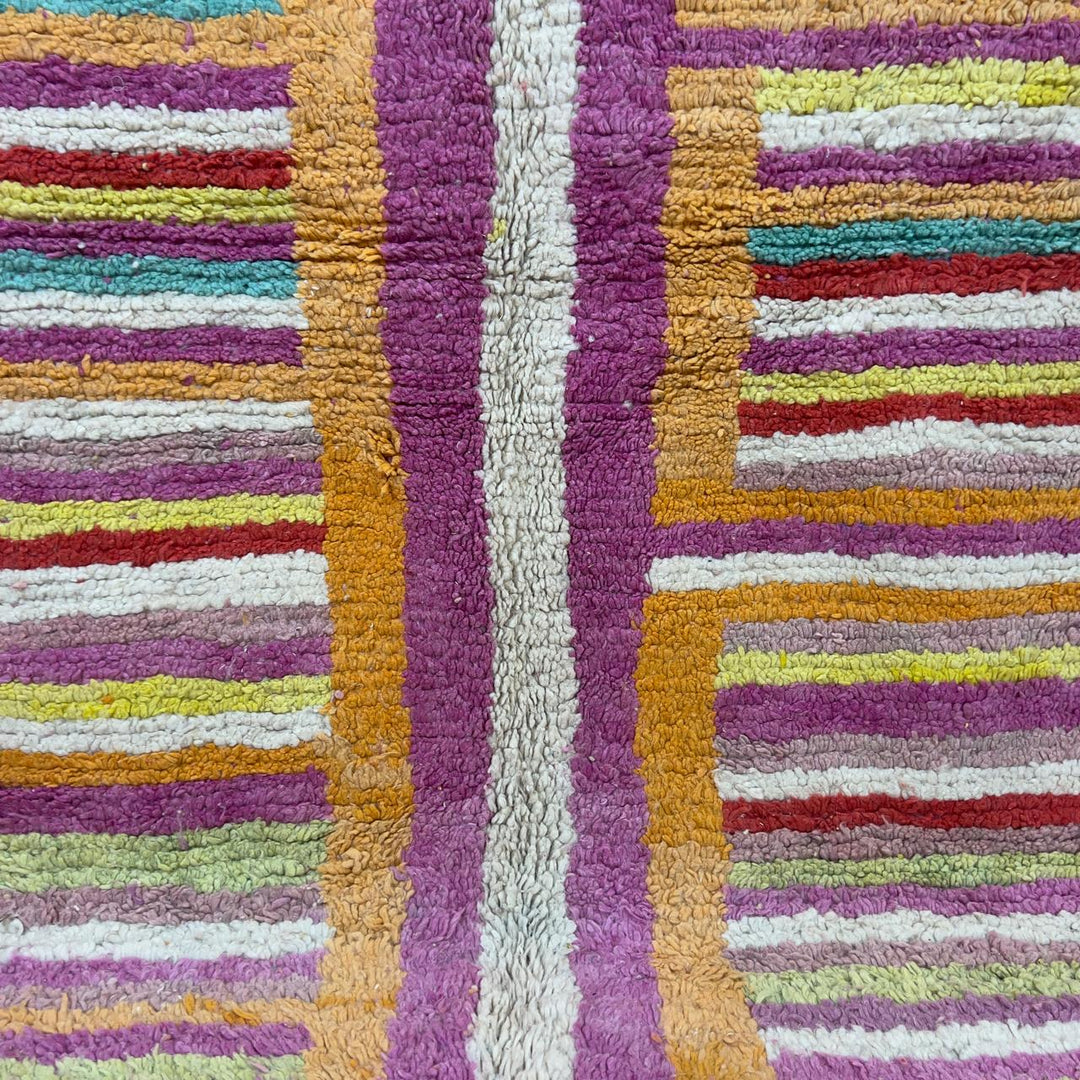 Vintage Moroccan wool rug 8.53x5.84 ft, handmade Berber shag rug with colorful striped pattern and central geometric design in yellow, pink, turquoise and red tones