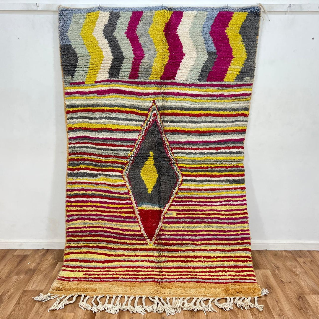 Vintage Moroccan wool rug with red, yellow, grey and ivory stripes and central diamond motif, handwoven Berber rug 235x152 cm