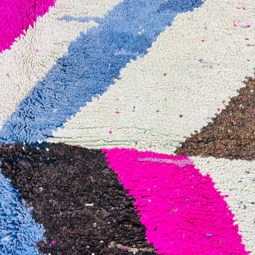 Vintage Moroccan wool rug with abstract Berber geometric pattern in pink, ivory, blue, and black