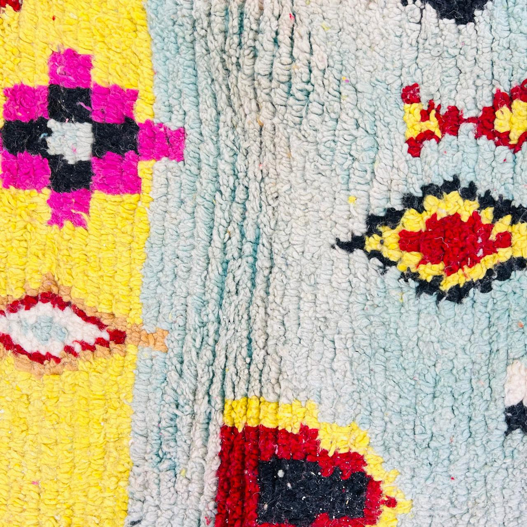 Vintage Moroccan wool rug with colorful Berber geometric symbols, handmade in Morocco