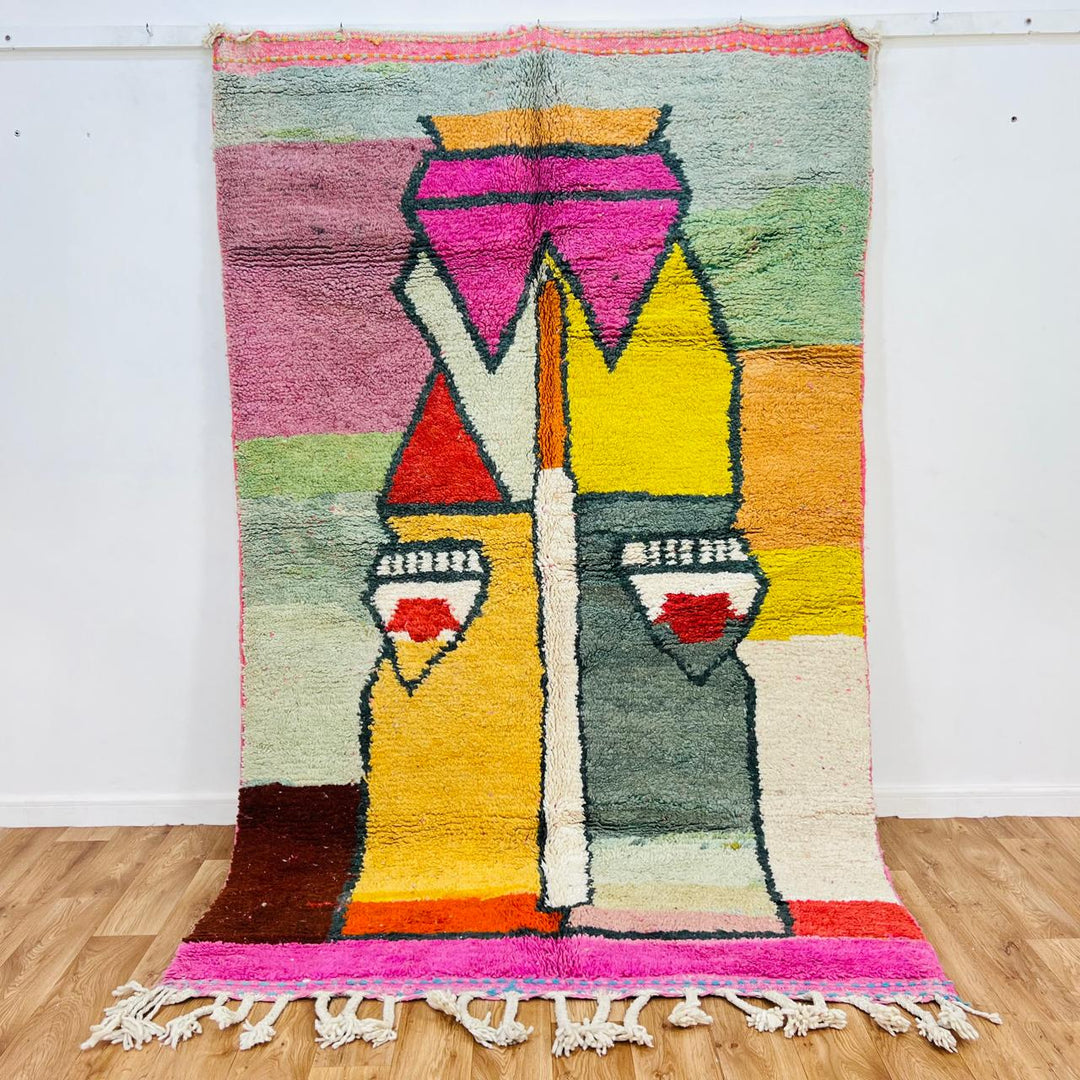 Vintage Moroccan wool rug with colorful geometric Berber pattern in pink yellow green and cream – handmade in Morocco