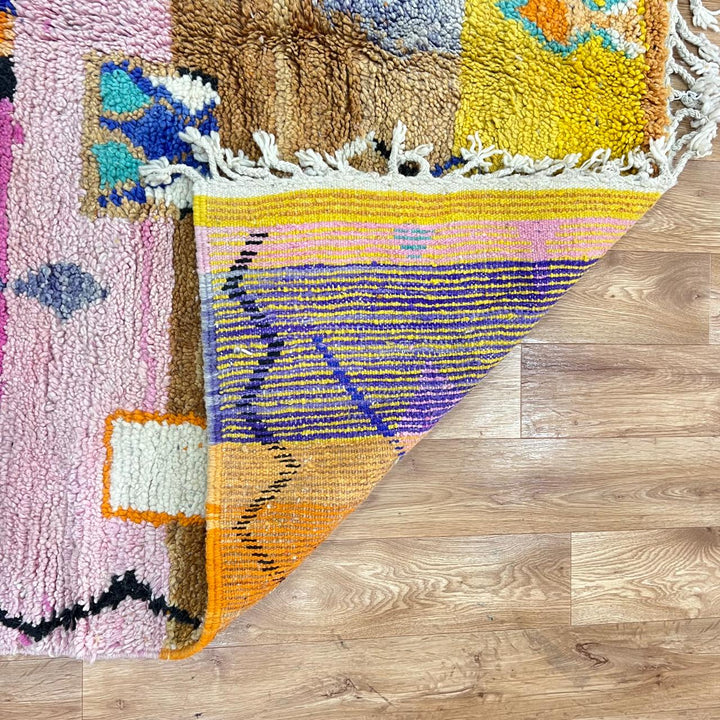 Vintage Moroccan Berber rug with abstract tribal design on pink wool, handmade in Morocco