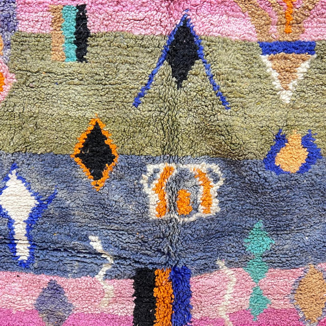 Vintage Moroccan Berber rug with abstract tribal design on pink wool, handmade in Morocco
