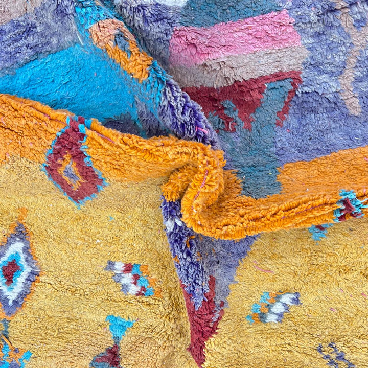 Vintage Moroccan golden wool rug with turquoise and tribal Berber symbols, handmade in Morocco