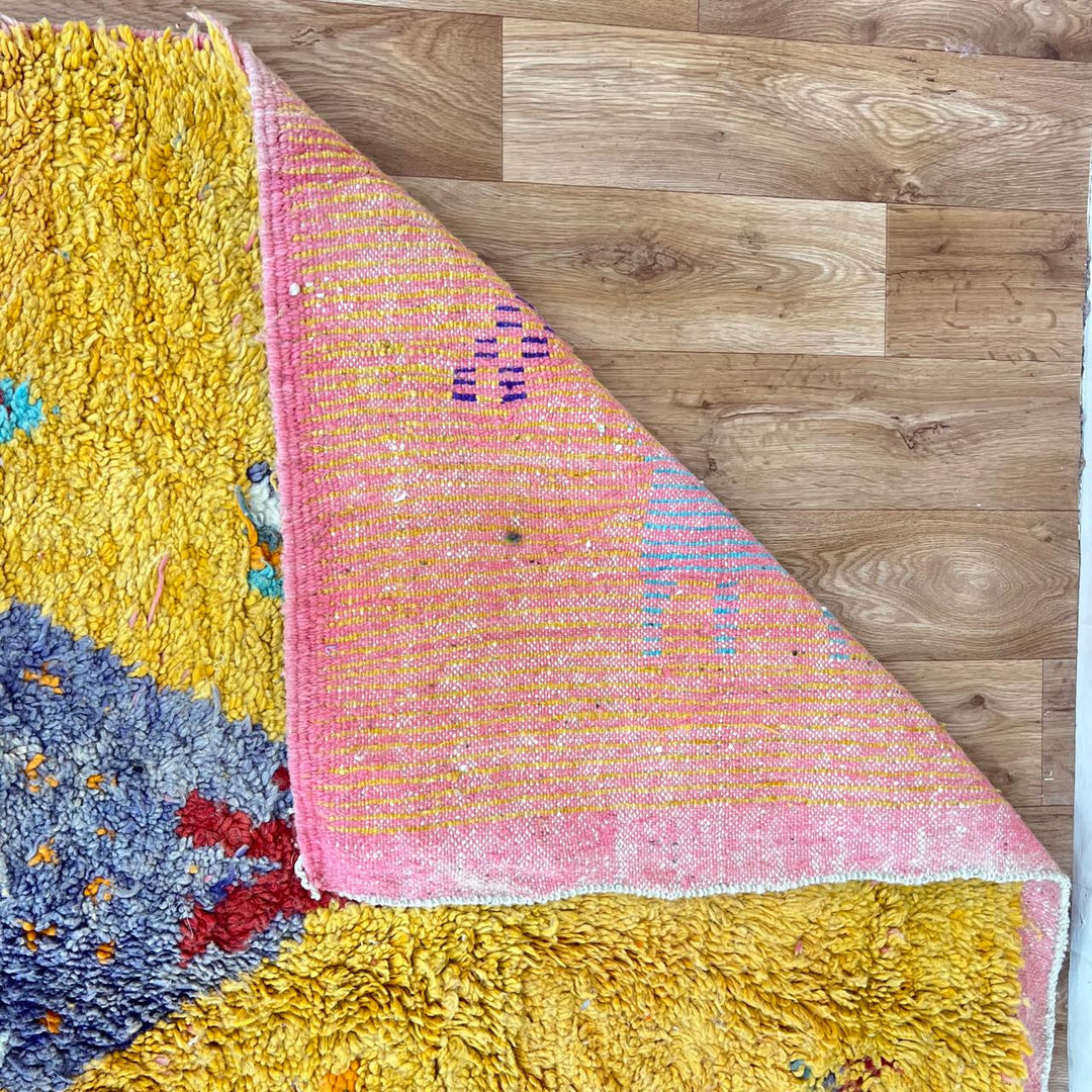 Vintage Moroccan golden wool rug with turquoise and tribal Berber symbols, handmade in Morocco