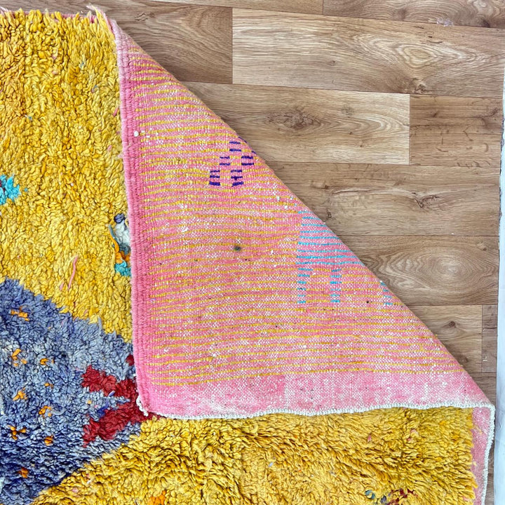 Vintage Moroccan golden wool rug with turquoise and tribal Berber symbols, handmade in Morocco