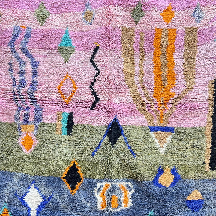 Vintage Moroccan Berber rug with abstract tribal design on pink wool, handmade in Morocco