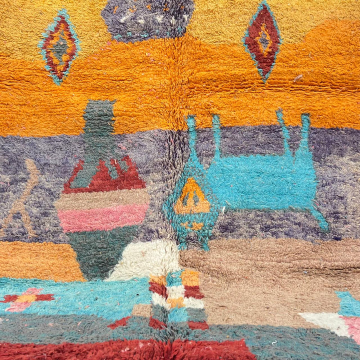 Vintage Moroccan golden wool rug with turquoise and tribal Berber symbols, handmade in Morocco
