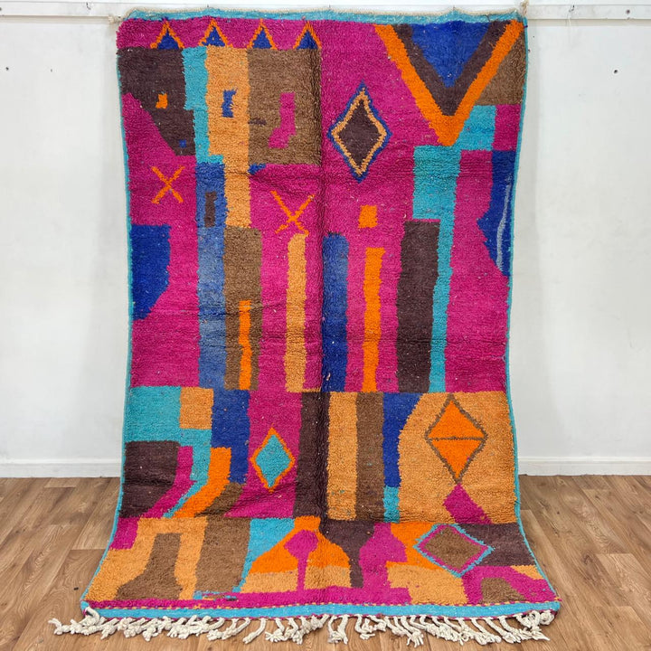 Vintage Moroccan wool rug with colorful Berber geometric patterns in pink, blue, and orange