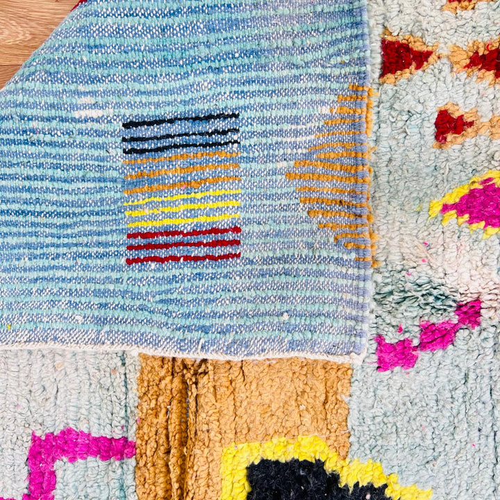 Vintage Moroccan wool rug with colorful Berber geometric symbols, handmade in Morocco