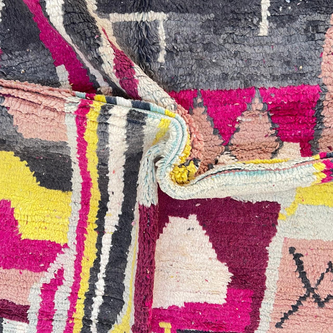 Vintage Moroccan wool rug with colorful abstract Berber geometric design in burgundy, pink, yellow and grey tones