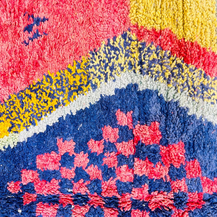 Vintage Moroccan wool rug with abstract Berber geometric design in coral pink, mustard yellow, navy and cream, handmade in Morocco