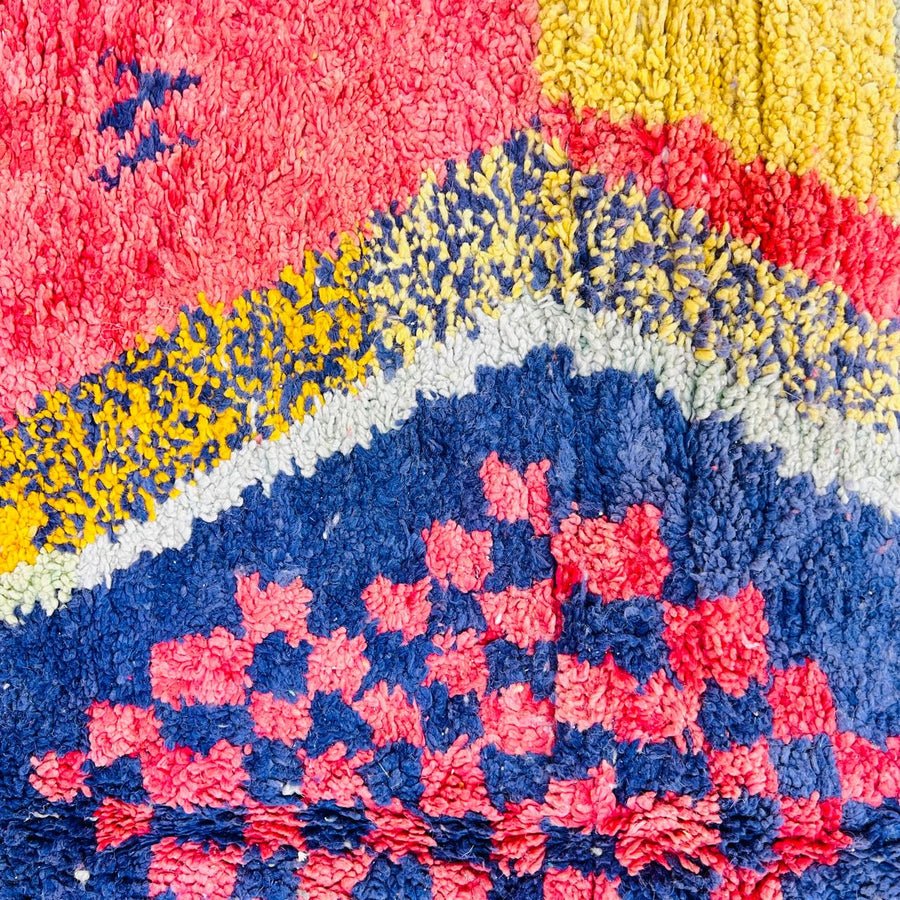 Vintage Moroccan wool rug with abstract Berber geometric design in coral pink, mustard yellow, navy and cream, handmade in Morocco