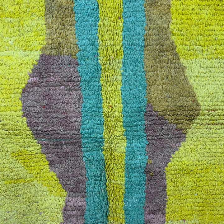 Vintage Moroccan wool rug 8.53x5.84 ft, handmade Berber shag rug with colorful striped pattern and central geometric design in yellow, pink, turquoise and red tones