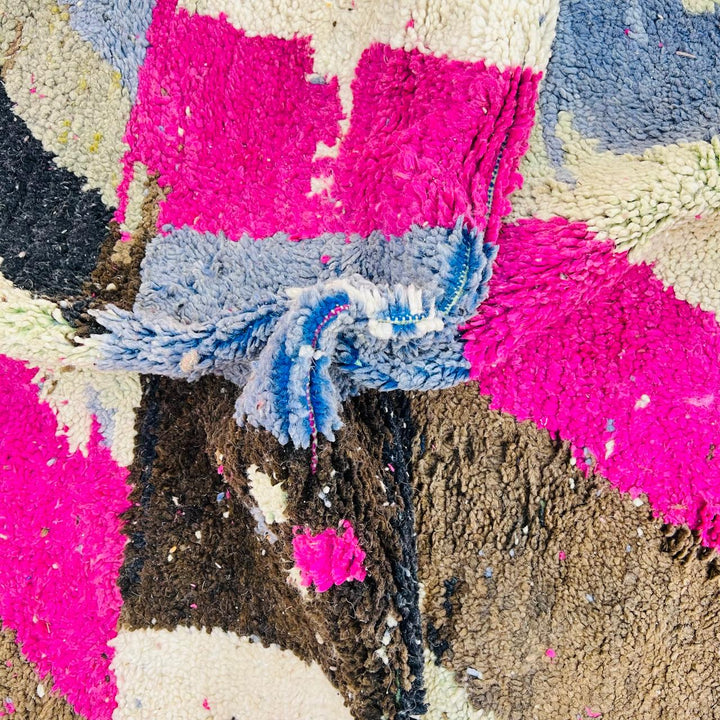 Vintage Moroccan wool rug with abstract Berber geometric pattern in pink, ivory, blue, and black