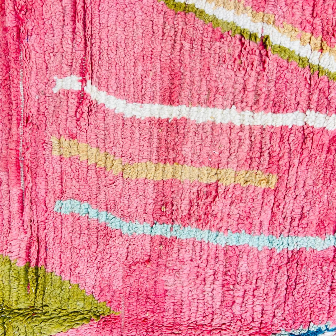 Vintage Moroccan wool rug with pink background and colorful Berber geometric symbols, handmade in Morocco