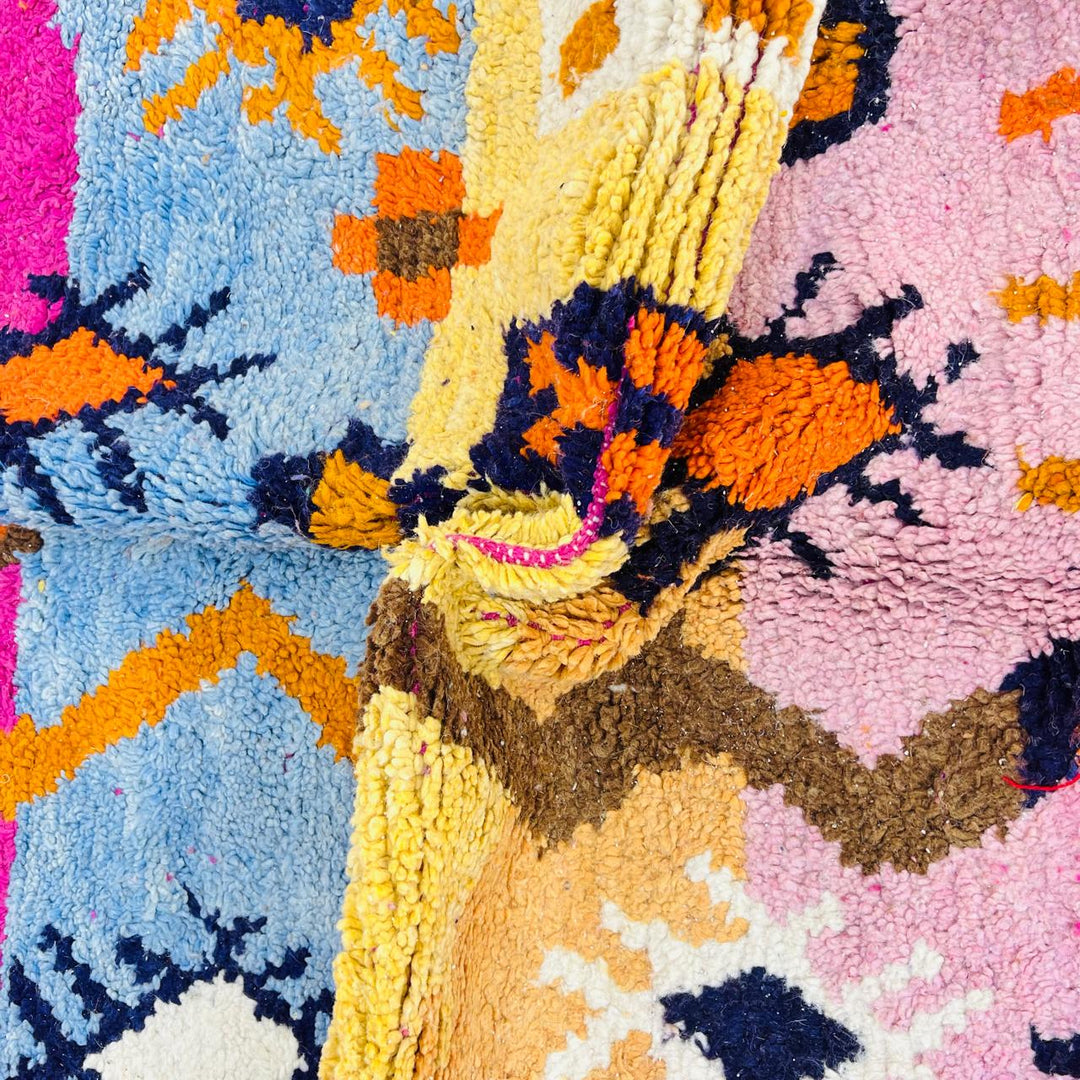 Vintage Moroccan wool rug with colorful Berber tribal symbols, handmade in Morocco