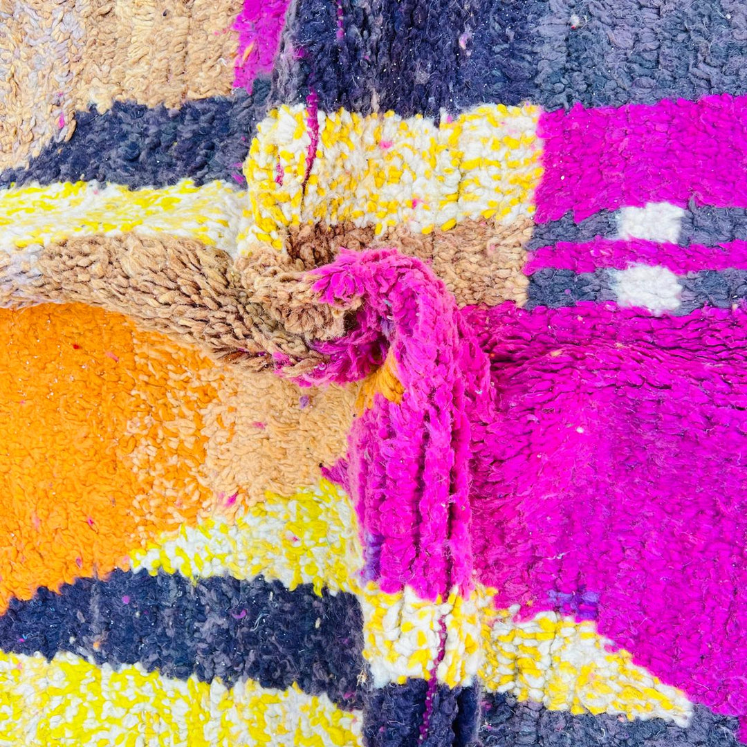 Handmade vintage Moroccan wool rug in pink and yellow with abstract Berber design. One-of-a-kind artisan rug, 255×166 cm.