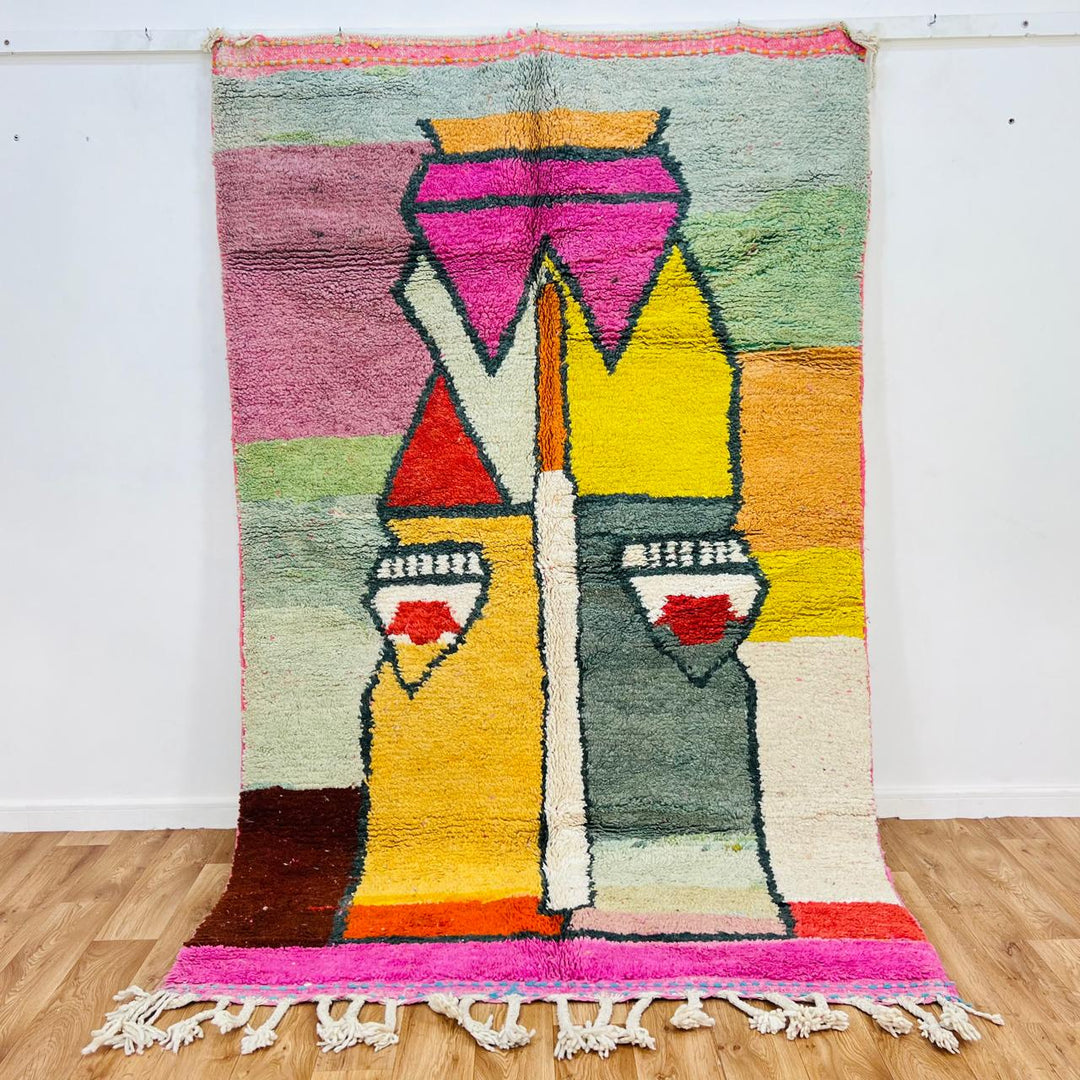 Vintage Moroccan wool rug with colorful geometric Berber pattern in pink yellow green and cream – handmade in Morocco