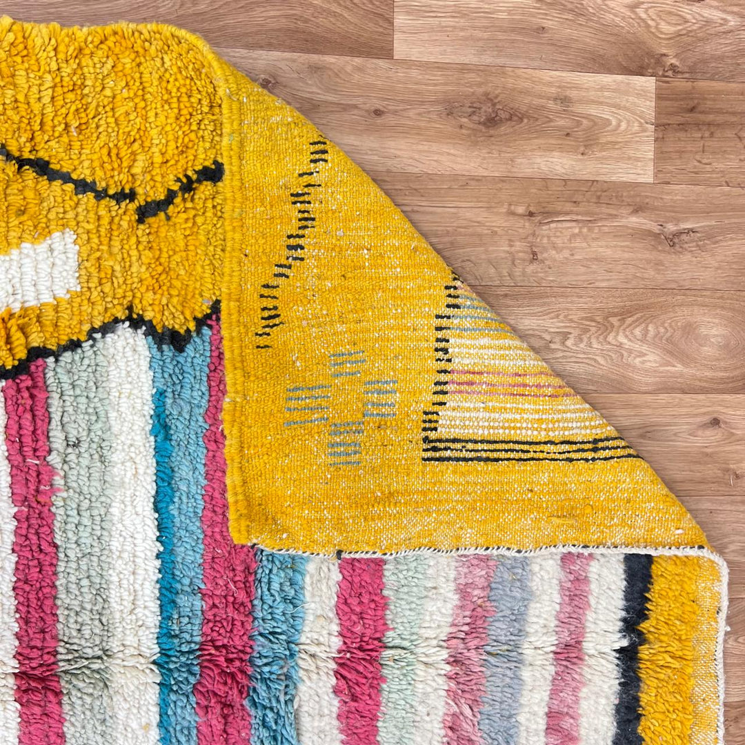 Vintage Moroccan wool rug with mustard yellow background and central striped pastel panel, abstract geometric Berber carpet 265x153 cm