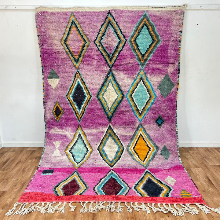 Vintage Moroccan wool rug with purple background and colorful diamond Berber patterns, handmade in Morocco