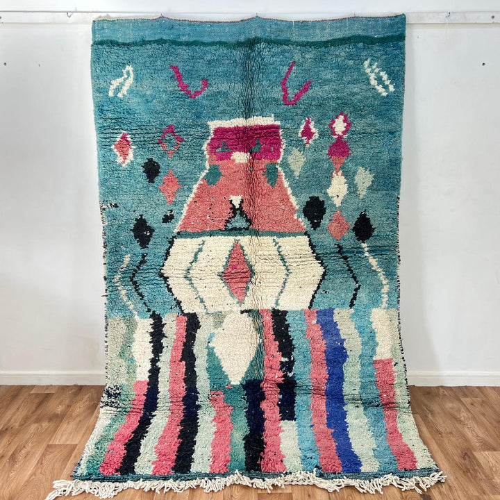 Vintage Moroccan wool rug in turquoise and pink tones with tribal Berber patterns, handmade in Morocco
