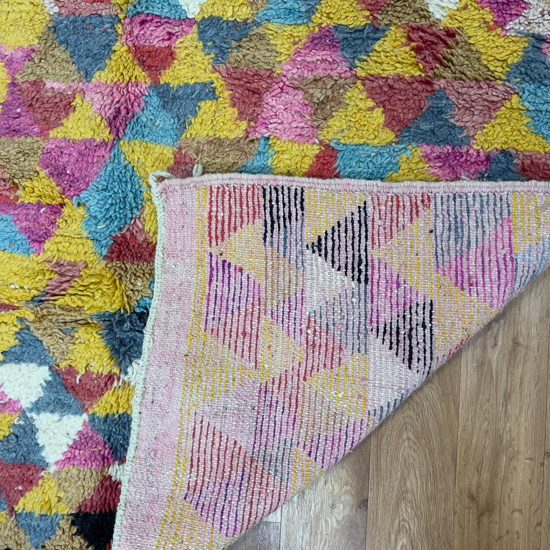 Vintage Moroccan wool rug 8.53x5.25 ft, handmade Berber rug with colorful triangle pattern and bold diagonal stripe design on yellow background