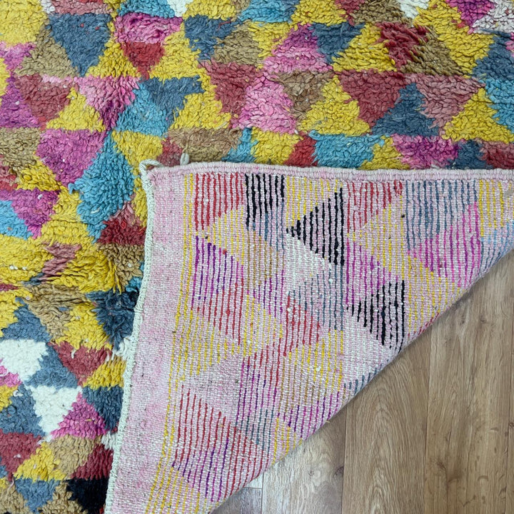 Vintage Moroccan wool rug 8.53x5.25 ft, handmade Berber rug with colorful triangle pattern and bold diagonal stripe design on yellow background