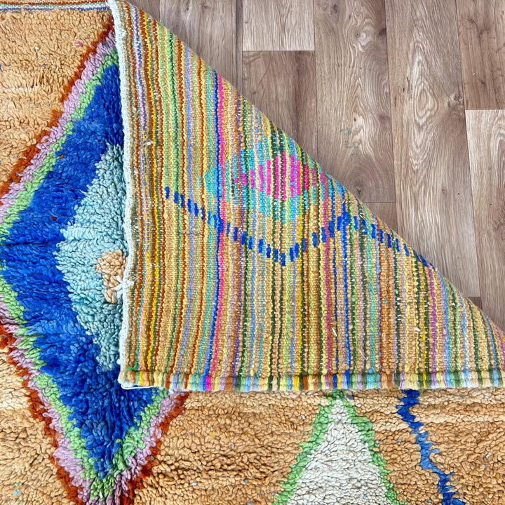 Vintage Moroccan wool rug with colorful Berber diamond patterns, handmade geometric area rug