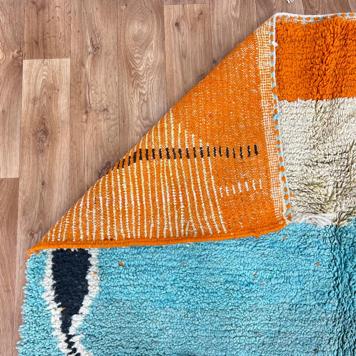 Vintage Moroccan Berber rug with bold abstract stripes in orange turquoise and ivory wool