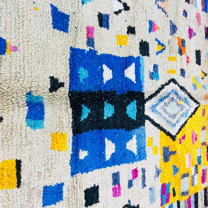 Vintage Moroccan wool rug with colorful geometric Berber pattern, handmade in Morocco